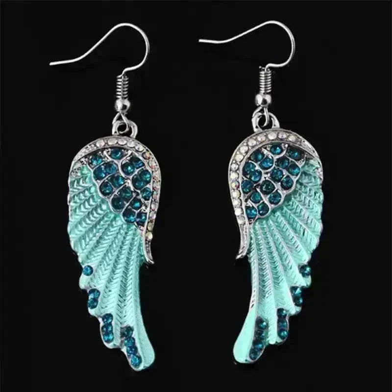 Angel wings fashion earrings with rhinestones, dangle design.