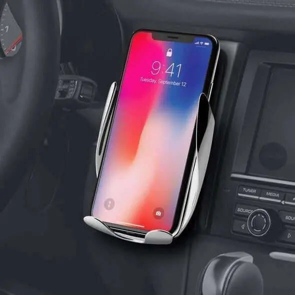 Automatic Clamping Wireless Car Charger mounted on dashboard with phone charging.