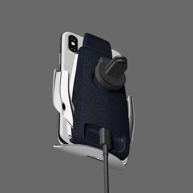 Automatic clamping wireless car charger with attached smartphone, featuring air vent mount and USB connection for seamless in-vehicle charging.