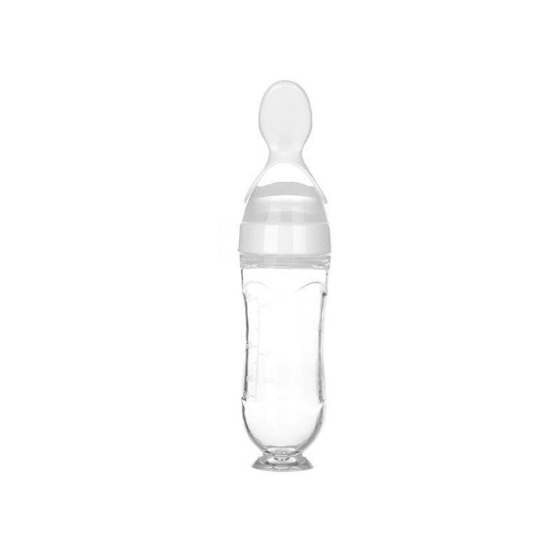 Baby squeezing feeding bottle with soft silicone spoon, ideal for transitioning to solid feeding.
