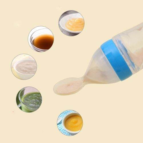 Baby Squeezing Feeding Bottle with Spoon dispensing puree.