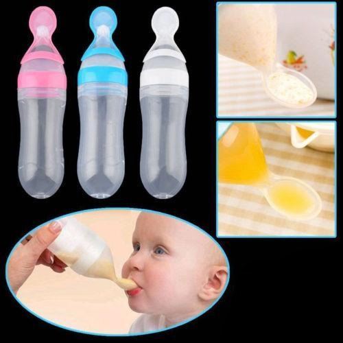 Baby squeezing feeding bottle with spoon for soft feeding, ideal for transitioning from liquid to solid foods.