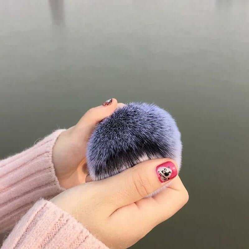Chubby Face Makeup Brush in hand, soft bristles, portable foundation tool.