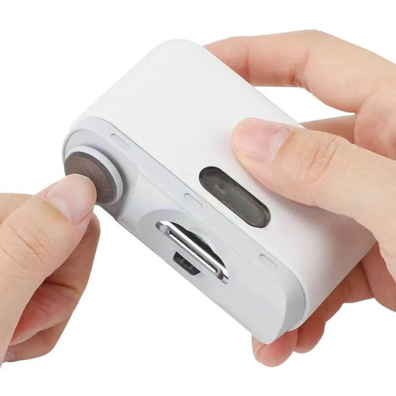Compact white electric nail cutter with USB-C charging and built-in LED light