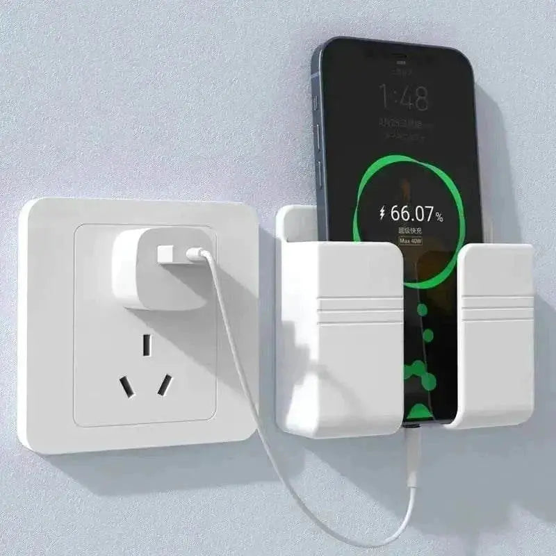 Wall-mounted mobile phone holder with phone charging, next to power socket.