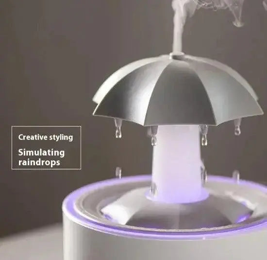 Rotating aroma humidifier with raindrop simulation and creative styling.