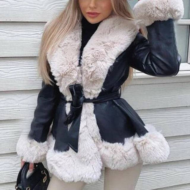 Woman wearing a chic Autumn/Winter PU Leather Coat with a fur collar and lace-up waist detail.