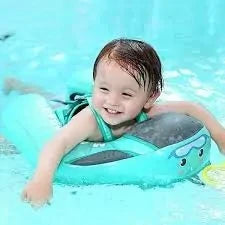 Toddler using a smart swim trainer float in a pool for swimming confidence and safety development