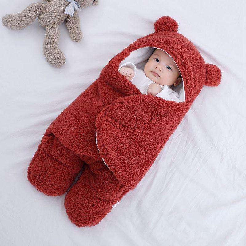 Ultra-soft starfish baby sleeping bag in red, cozy design with hood.