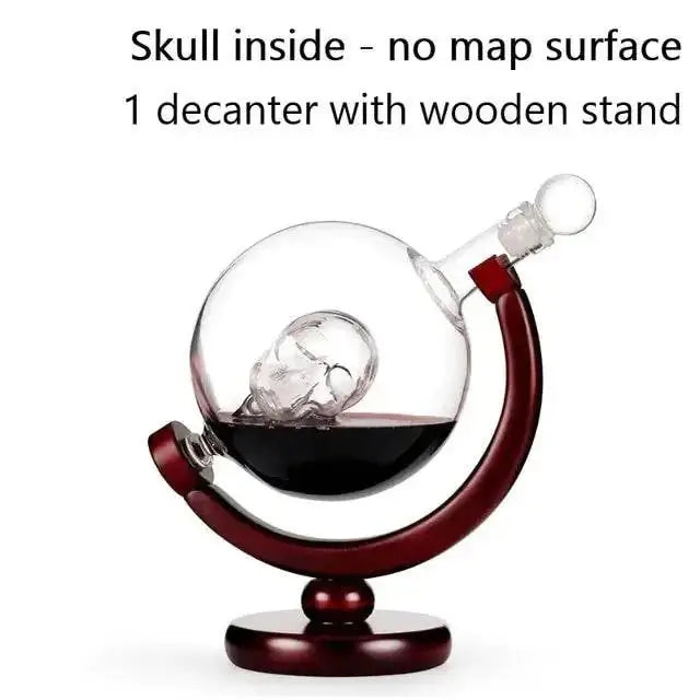 Whiskey decanter globe with skull motif and wooden stand.